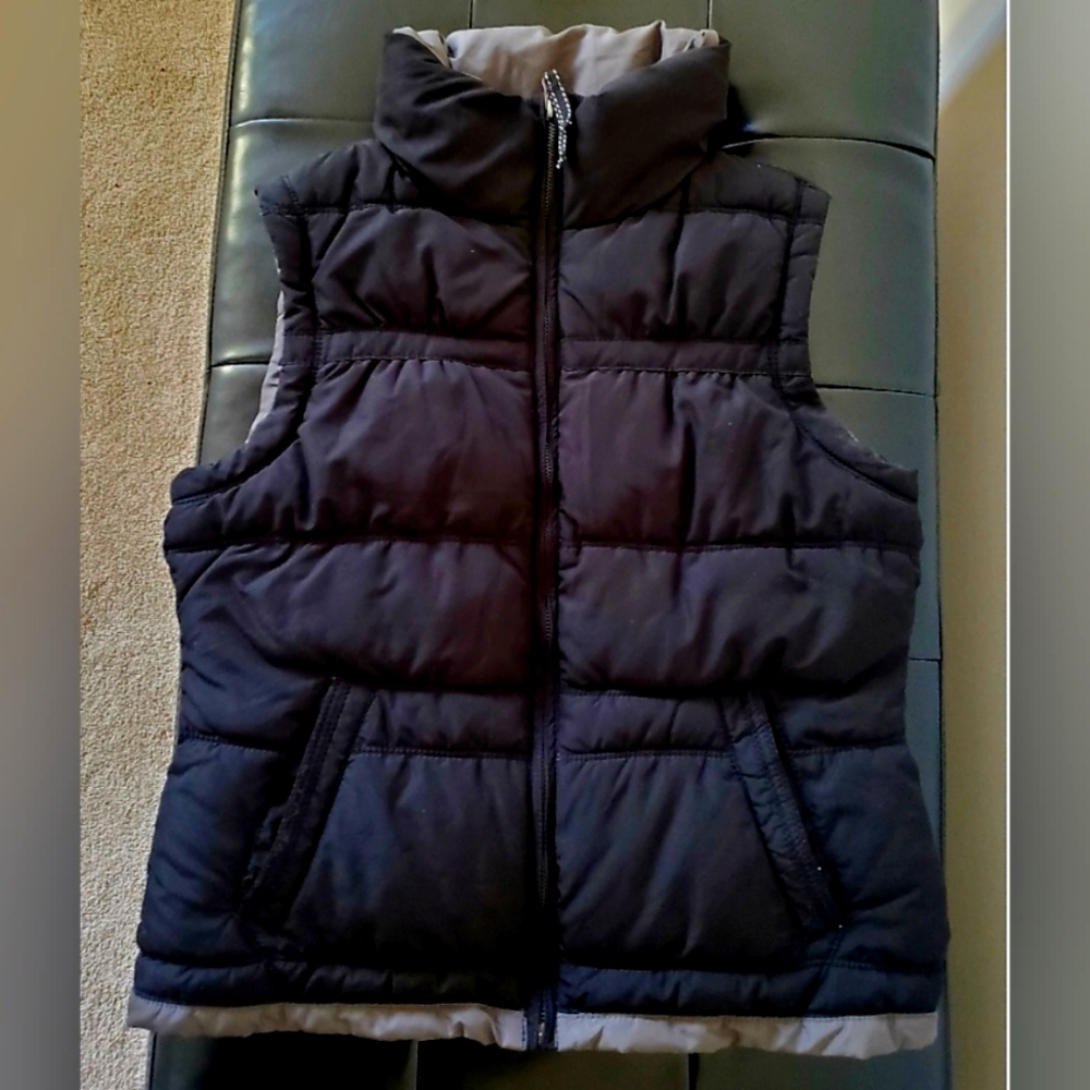 Black high collared zip up puffer vest